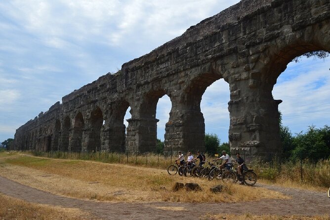 Appian Way Bike tour Underground with Catacombs & Lunch - Cecilia Metella and Castrum Caetani: best-preserved Appian Way monument