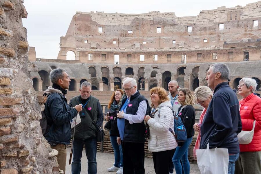 Colosseum Guided Tour: Hotel Transport included - Entering the Colosseum: first and second levels with a guide