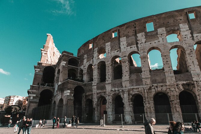 Guided Tour of Colosseum, Roman Forum & Palatine Hill in Rome - Entering the Colosseum: Gladiators, Politics, and the Ship-Fight Myth