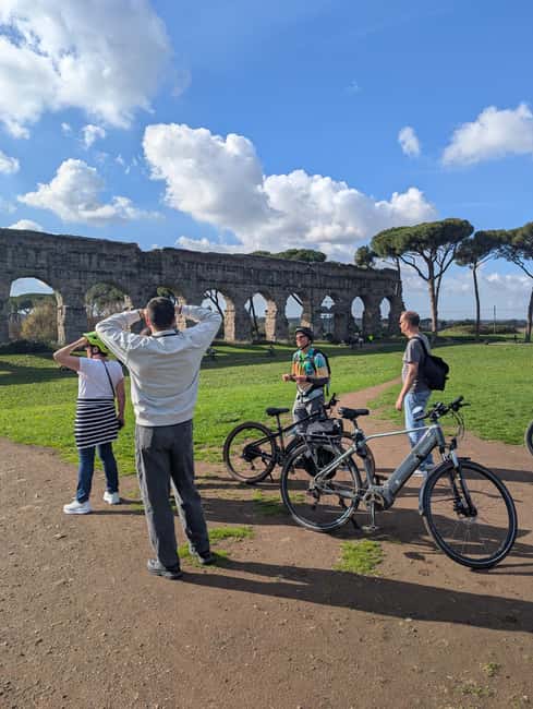 Rome: Appian Way, Aqueducts, & Catacombs E-Bike Guided Tour - Starting at San Sebastiano Fuori le Mura, then snapping photos at the big ruins