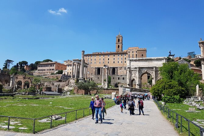 Rome: Colosseum, Palatine Hill and Roman Forum Guided Tour - Roman Forum: Temples, Curious Doorways, and the City’s Center