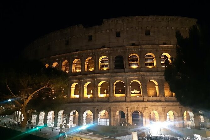 Rome: Colosseum Tour by Night with Arena & Underground - Entering the Colosseum and following the group plan
