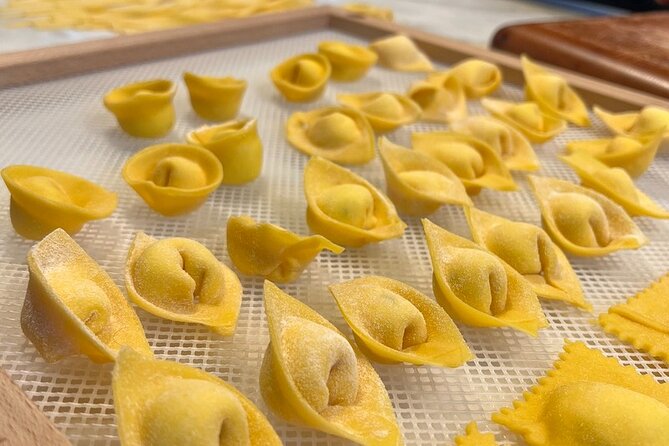 Rome Pasta Making Class with Italian Sauces and Wine Included - A family-style Rome kitchen: where you meet and what the vibe feels like